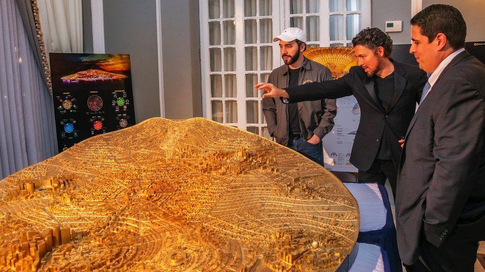 President Bukele studies a model of a planned city
